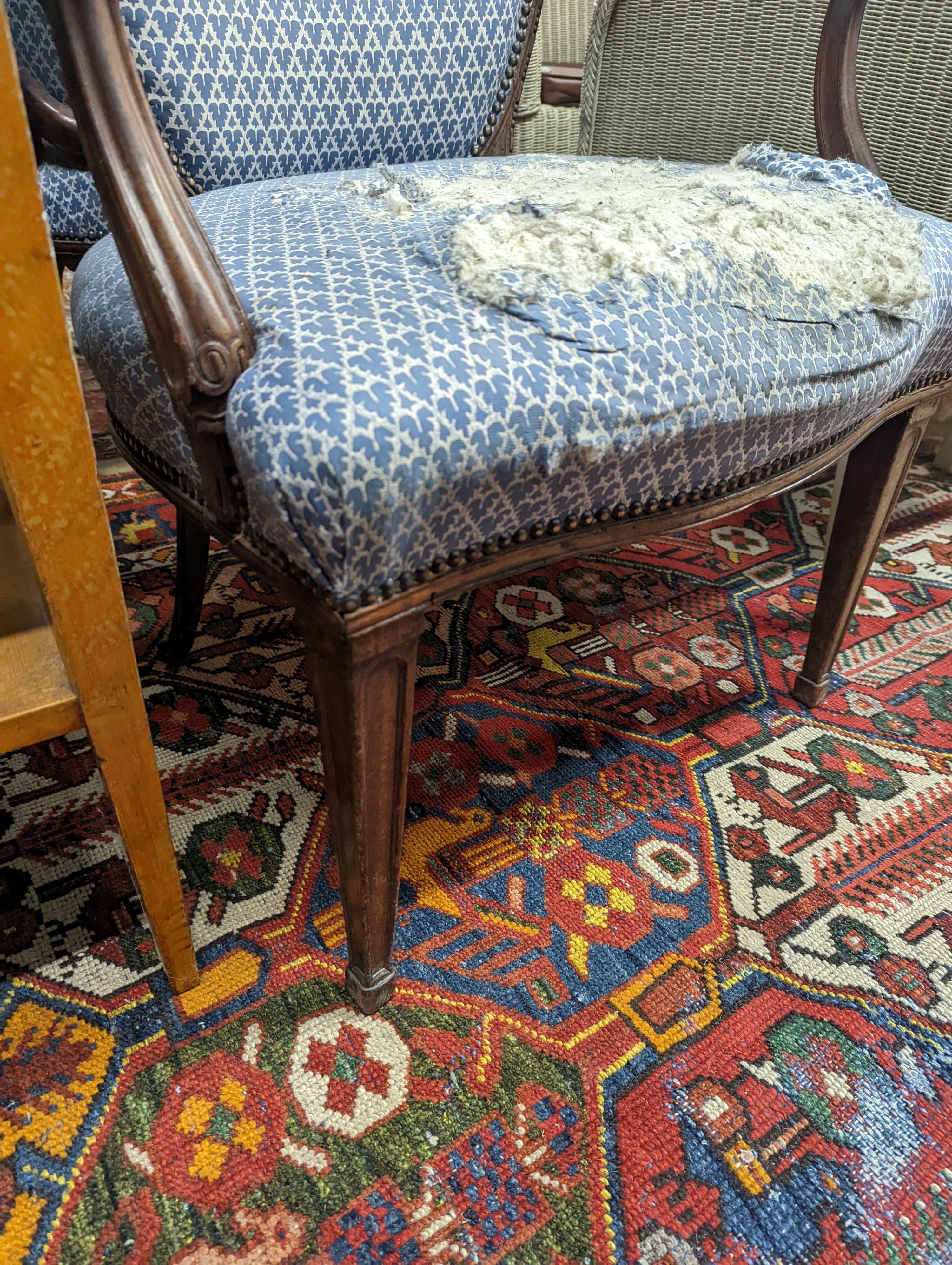 A pair of George III Hepplewhite style mahogany open armchairs, width 64cm, depth 50cm, height 92cm